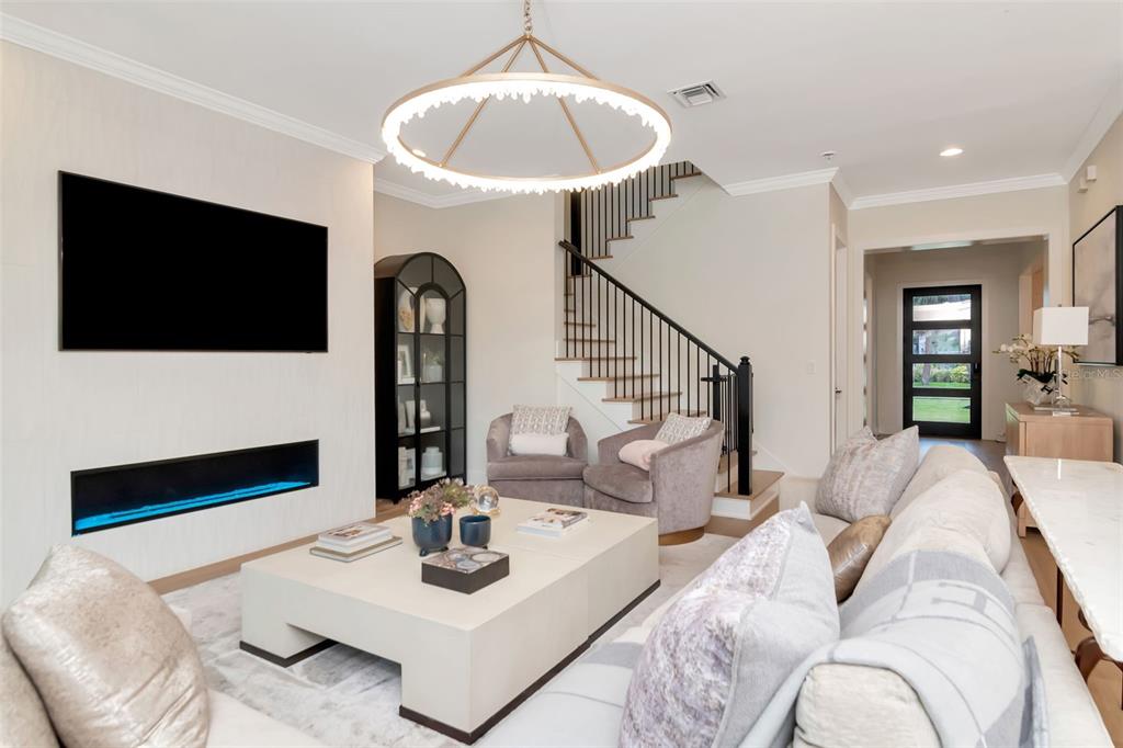 4111 West Swann Avenue Tampa, FL 33609 - Photo 23 of 49 a living room with furniture and a flat screen tv