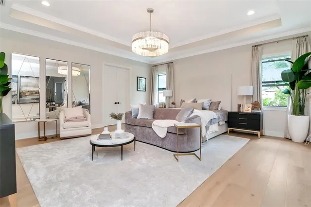 a living room with couch and a large window