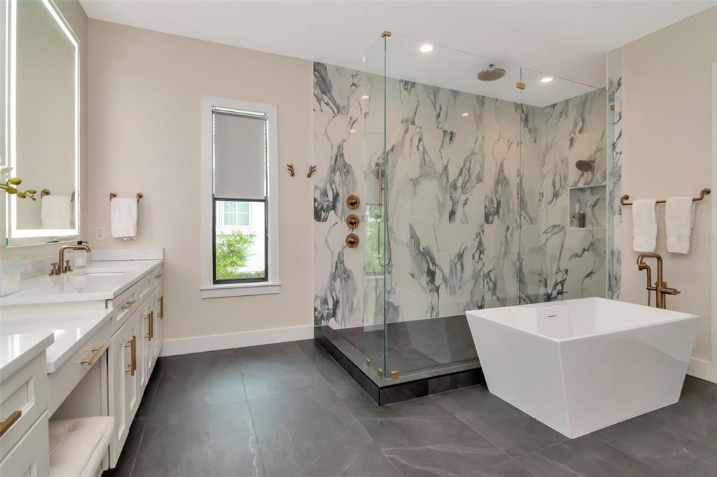 4111 West Swann Avenue Tampa, FL 33609 - Photo 33 of 49 a spacious bathroom with a tub a sink and shower