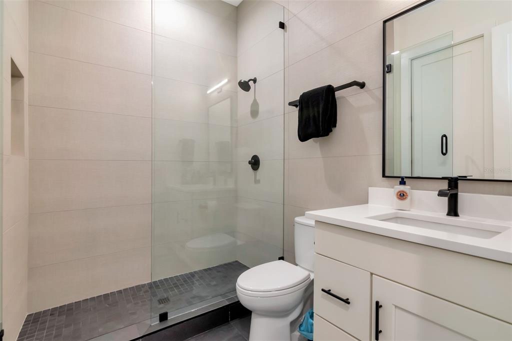 4111 West Swann Avenue Tampa, FL 33609 - Photo 37 of 49 a bathroom with a sink toilet and shower