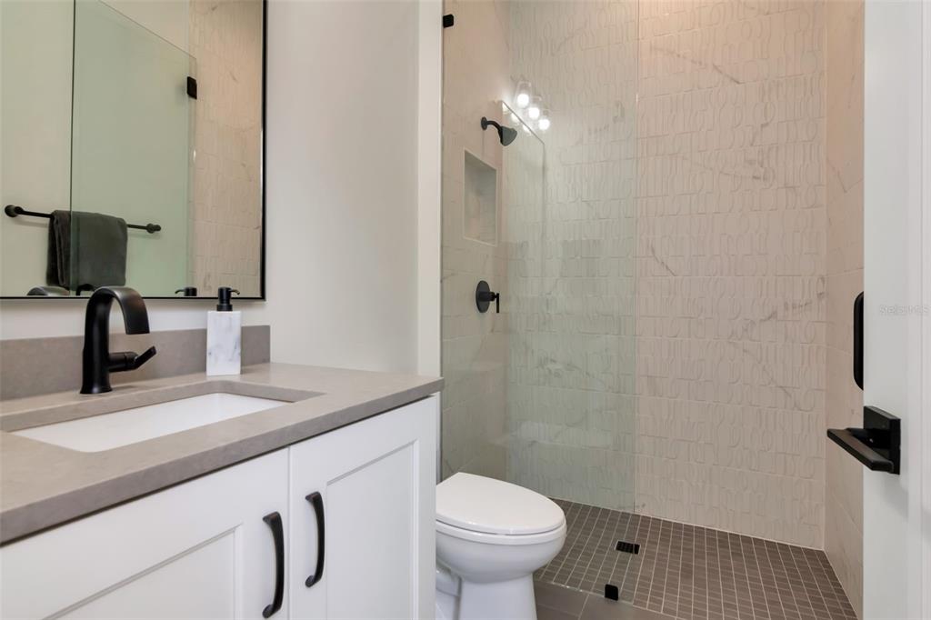 4111 West Swann Avenue Tampa, FL 33609 - Photo 38 of 49 a bathroom with a sink toilet and shower