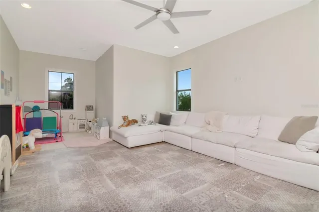 a living room with furniture and white walls