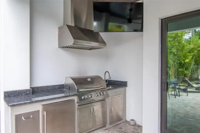 a kitchen with a sink and cabinets