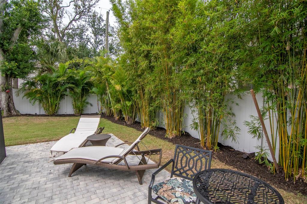 4111 West Swann Avenue Tampa, FL 33609 - Photo 43 of 49 a view of a patio with a table and chairs under an umbrella