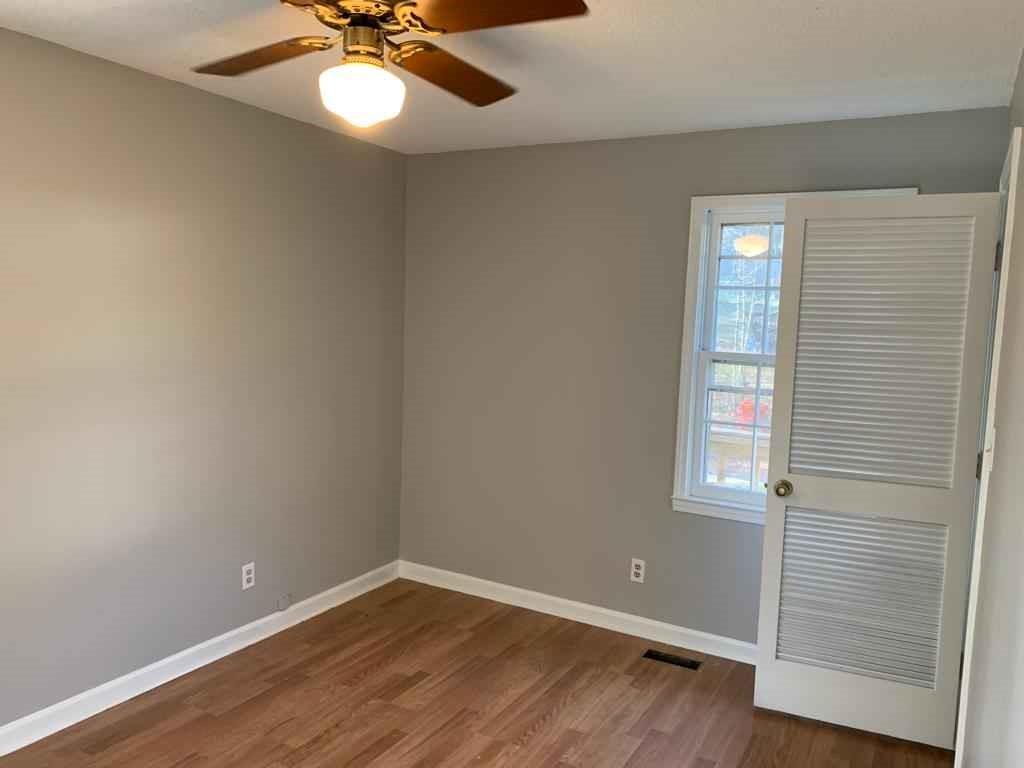 846 Idlewood Road Winder, GA 30680 - Photo 17 of 27 wooden floor in an empty room with a window