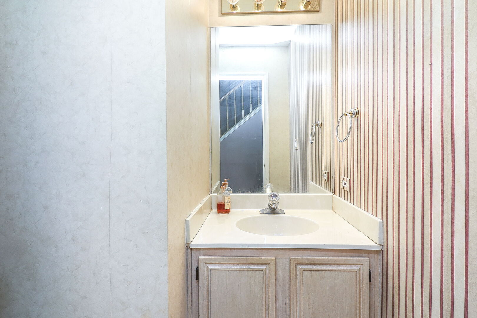 164 Springdale Lane Bloomingdale, IL 60108 - Photo 12 of 30 a bathroom with a sink and a mirror