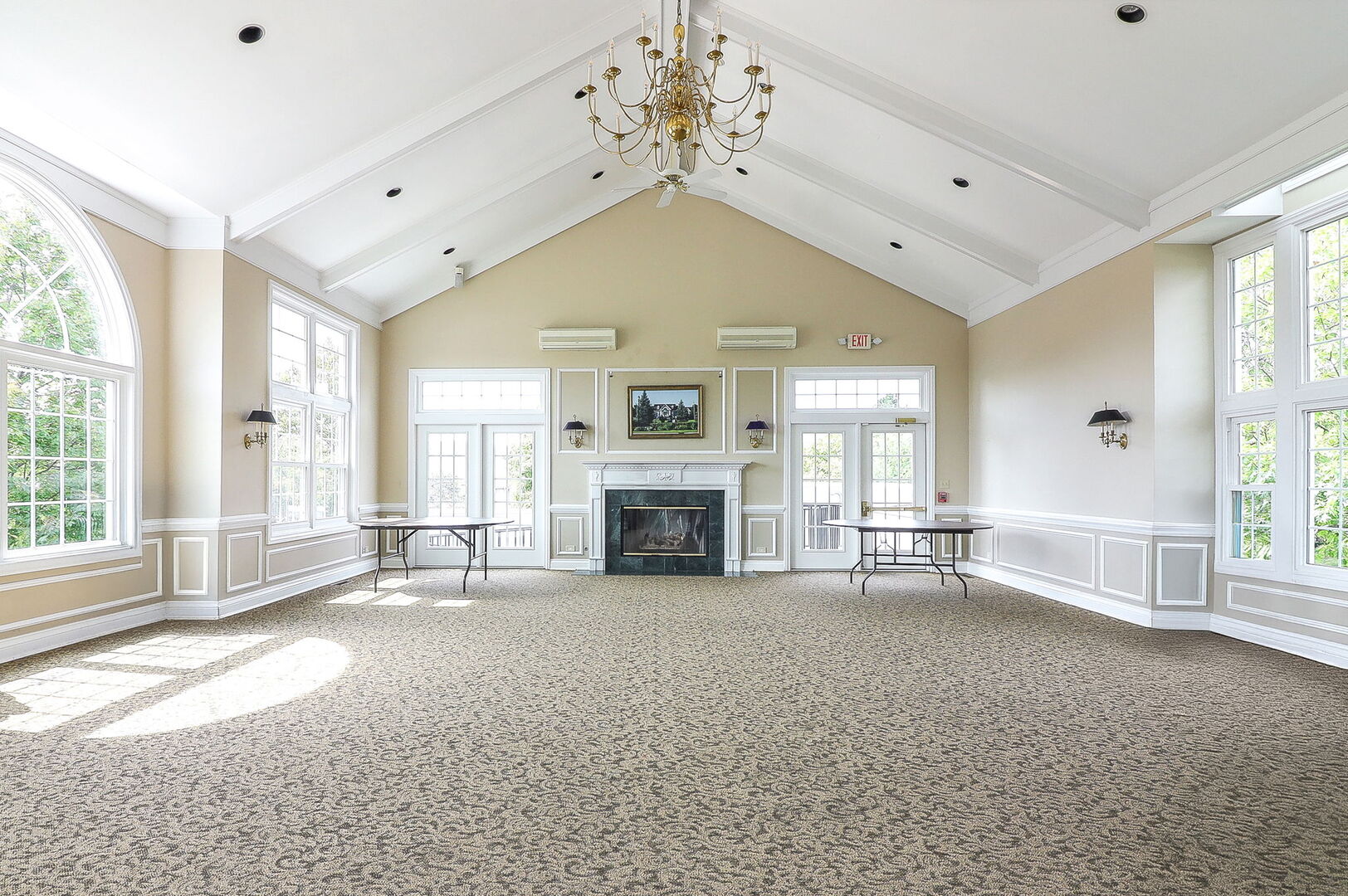 164 Springdale Lane Bloomingdale, IL 60108 - Photo 24 of 30 a view of a livingroom with a fireplace large windows and a chandelier