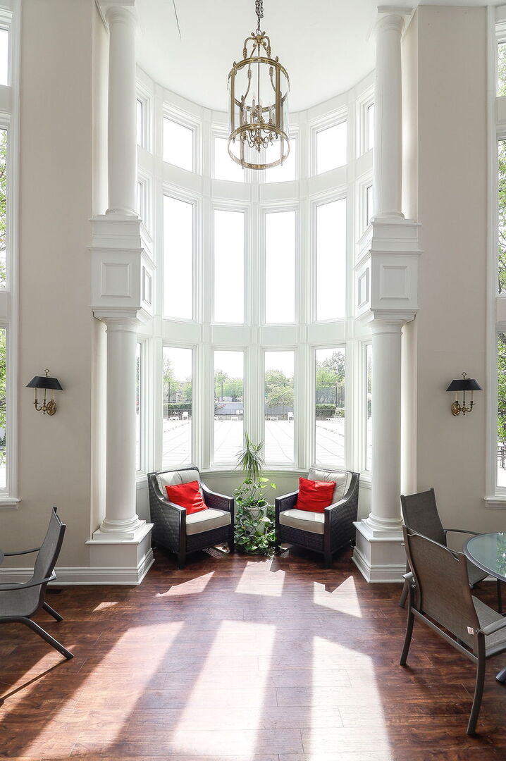 164 Springdale Lane Bloomingdale, IL 60108 - Photo 26 of 30 a living room with furniture and floor to ceiling windows