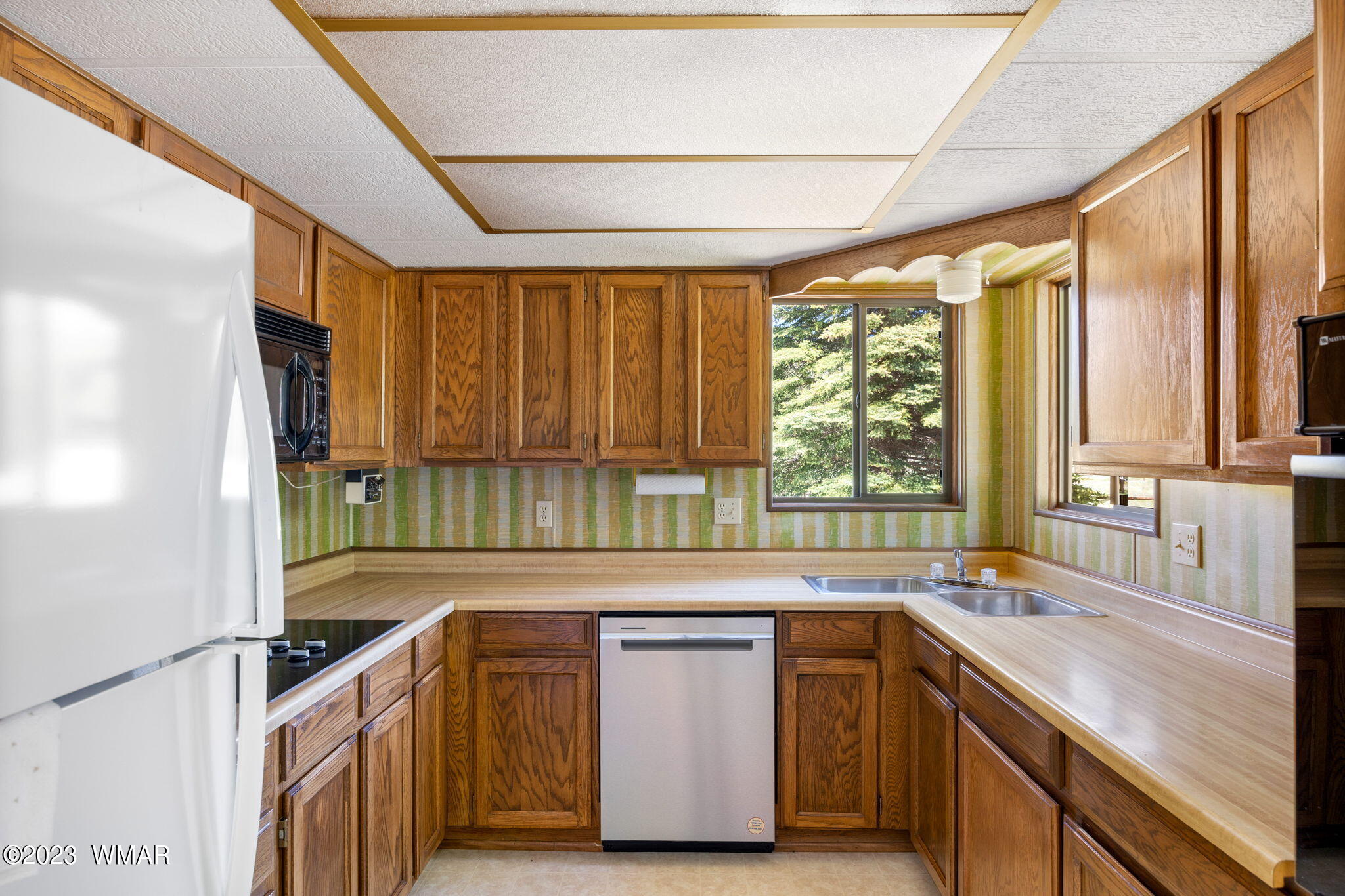7 County Road 2043 Alpine, AZ 85920 - Photo 12 of 32 a kitchen with a sink and a large window