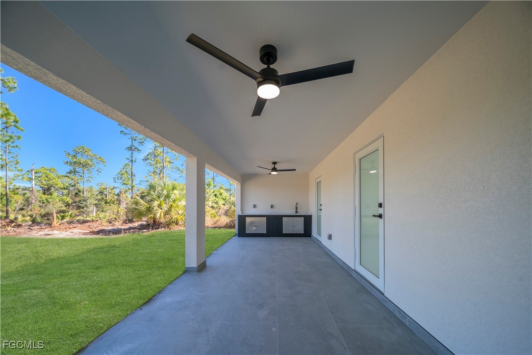 855 Foxtail Street East Lehigh Acres, FL 33974 - Photo 17 of 23 a view of empty room with floor to ceiling window and ceiling fan