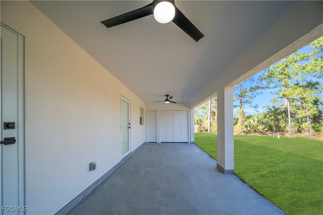 855 Foxtail Street East Lehigh Acres, FL 33974 - Photo 19 of 23 a view of a big room with floor to ceiling windows and yard