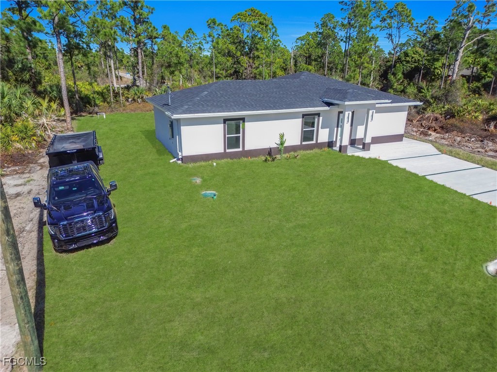 855 Foxtail Street East Lehigh Acres, FL 33974 - Photo 21 of 23 a aerial view of a house with a garden