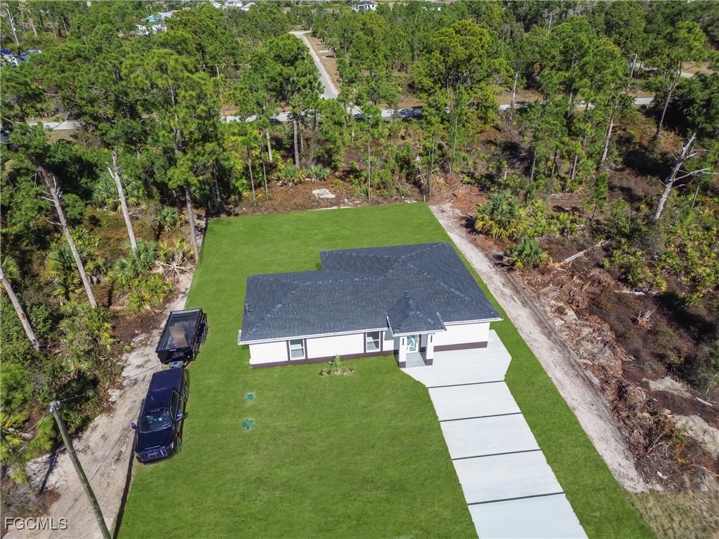 855 Foxtail Street East Lehigh Acres, FL 33974 - Photo 22 of 23 a view of yard with swimming pool