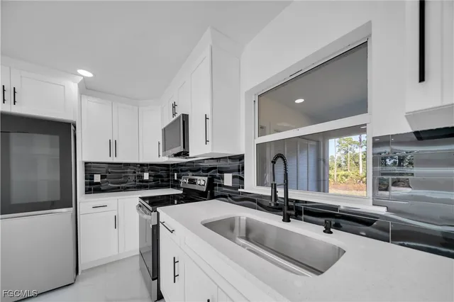 $279,900 | 855 Foxtail Street East, Lehigh Acres, FL 33974