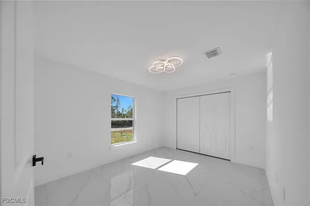 $279,900 | 855 Foxtail Street East, Lehigh Acres, FL 33974