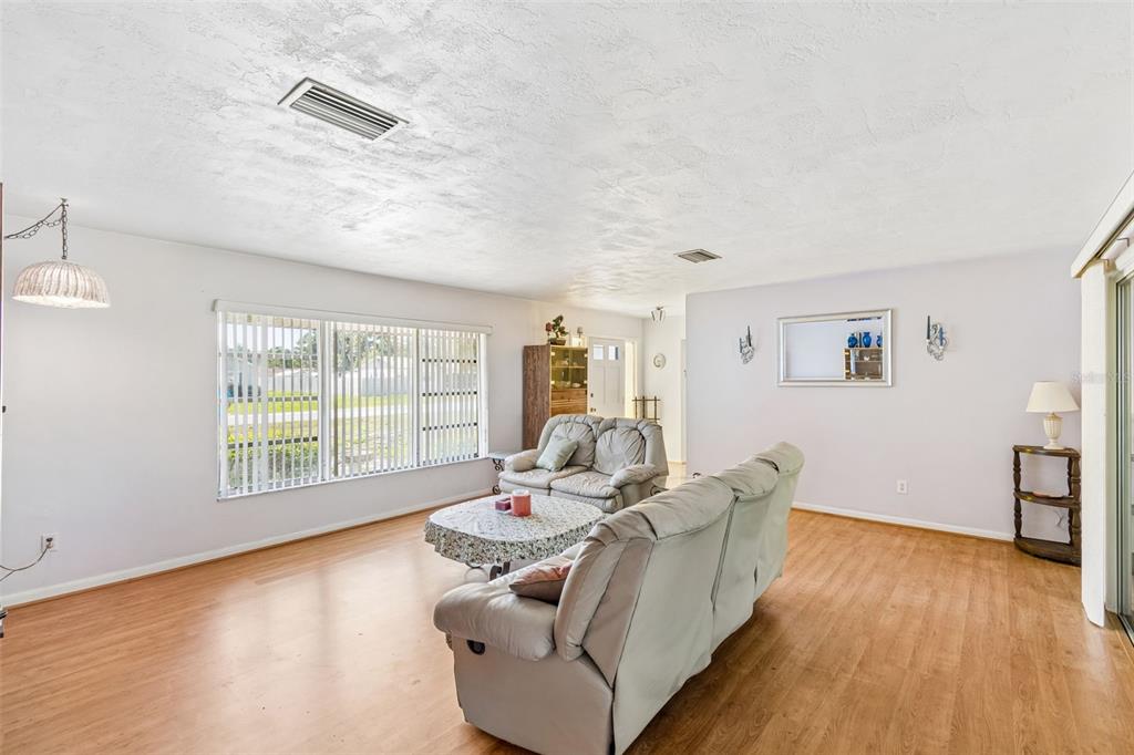 2059 Waterfall Drive Spring Hill, FL 34608 - Photo 4 of 26 a living room with furniture and a large window