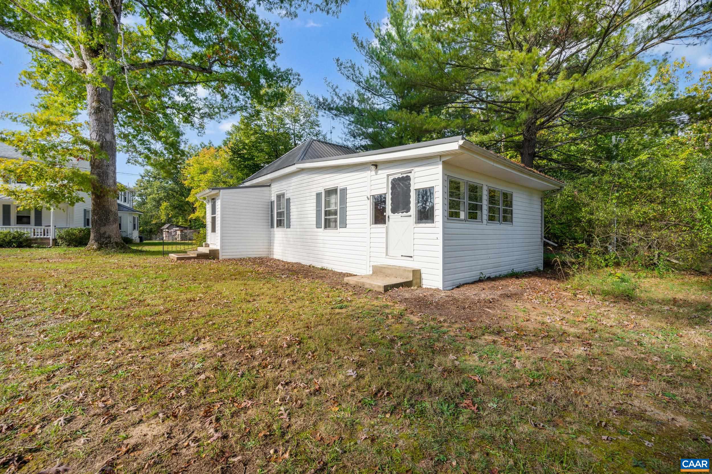 9915 Howardsville Road Howardsville, VA 24562 - Photo 38 of 68 a front view of house with yard and trees