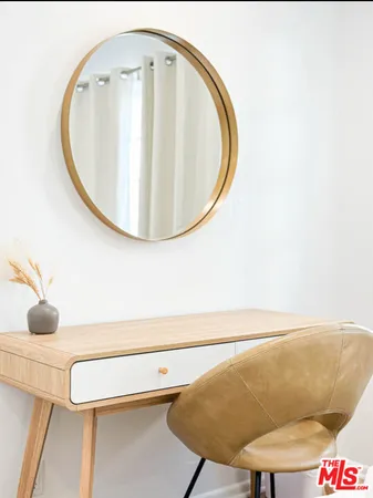 a bathroom with a sink mirror and toilet