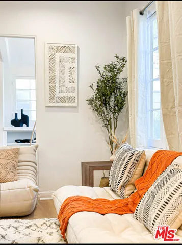 a bedroom with bed and a window