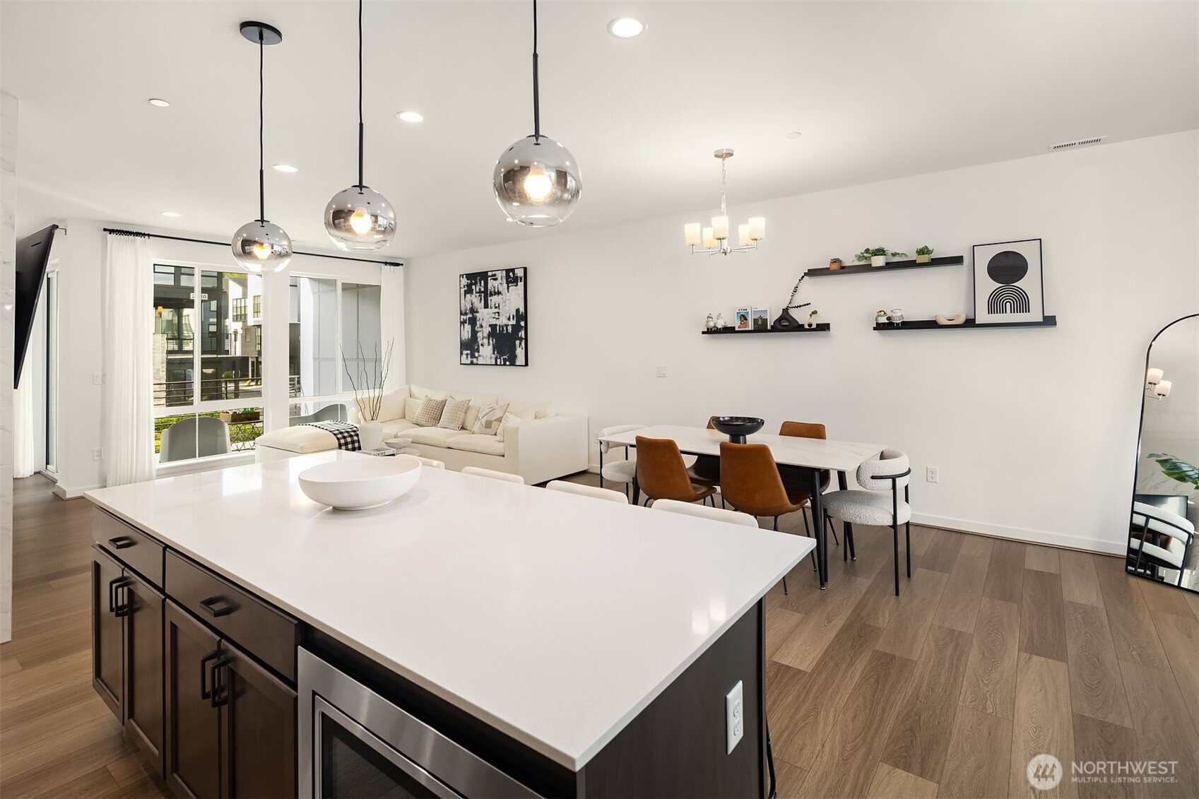 21822 25th Avenue Southeast, Unit B Bothell, WA 98021 - Photo 11 of 34 a open kitchen with stainless steel appliances granite countertop a sink a stove and chairs