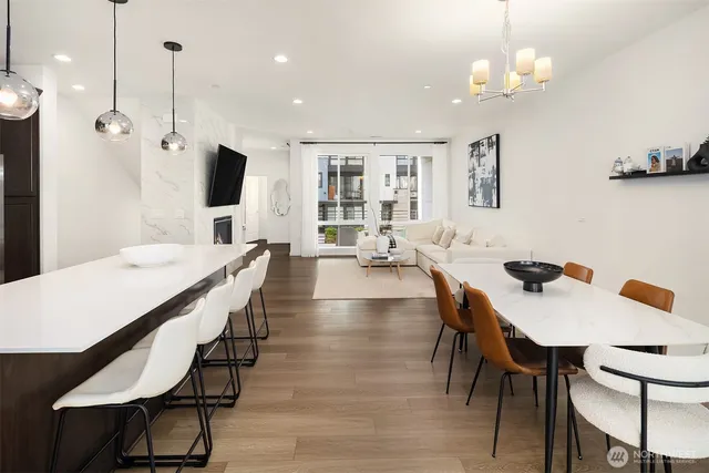 a large kitchen with a table and chairs