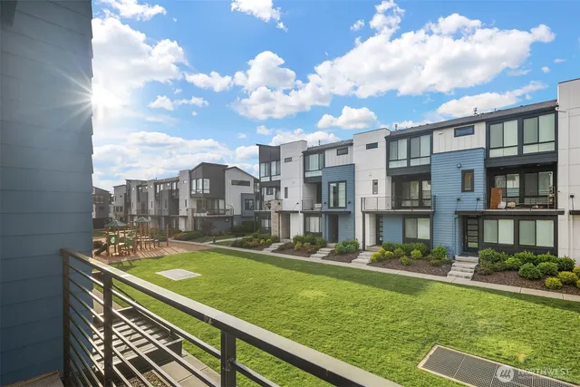 a view of a patio with a table and chairs
