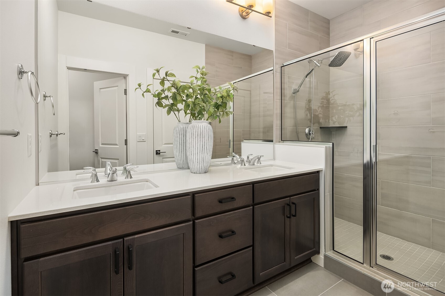 21822 25th Avenue Southeast, Unit B Bothell, WA 98021 - Photo 23 of 34 a bathroom with a double vanity sink and a mirror