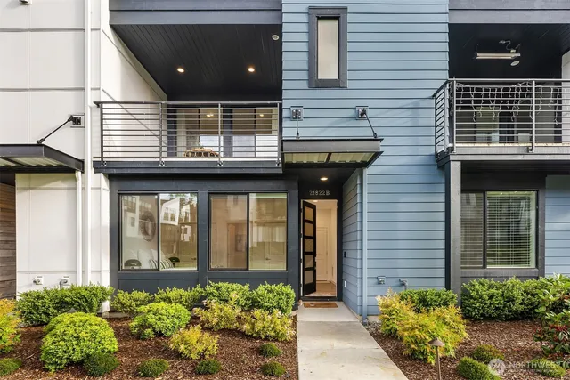 a view of a house with potted plants