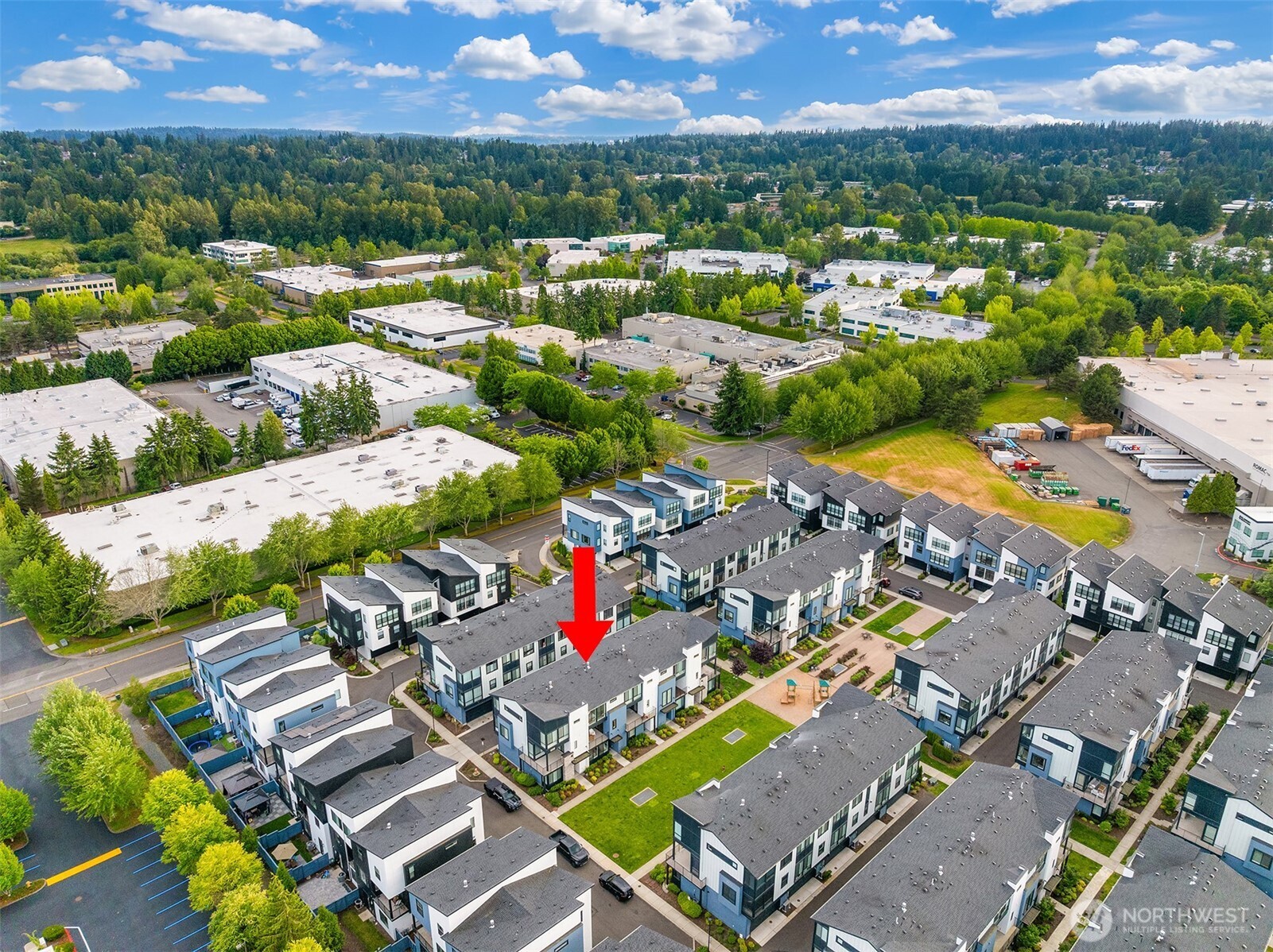21822 25th Avenue Southeast, Unit B Bothell, WA 98021 - Photo 33 of 34 an aerial view of a houses with a swimming pool