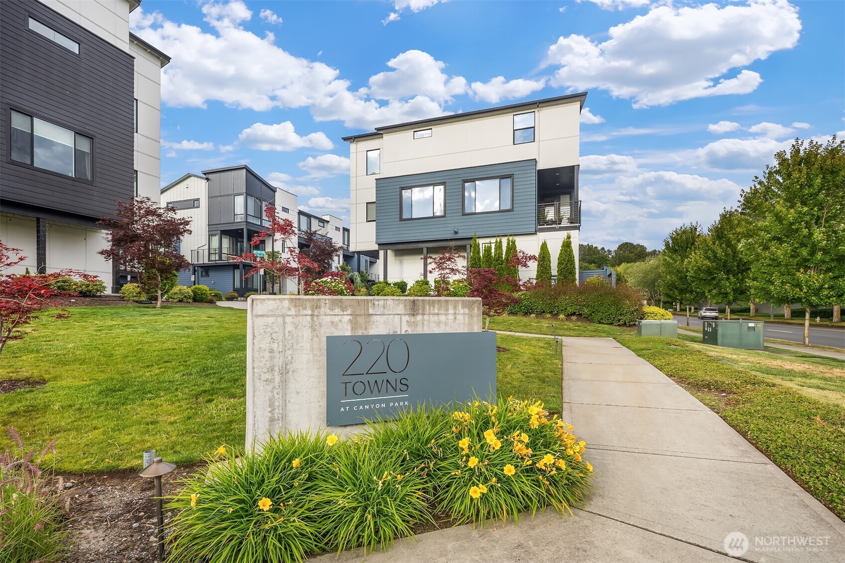 21822 25th Avenue Southeast, Unit B Bothell, WA 98021 - Photo 34 of 34 a front view of a house with garden