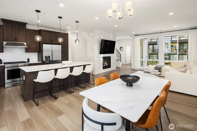 a large kitchen with a table and chairs