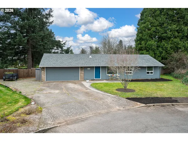 a aerial view of a house with a yard