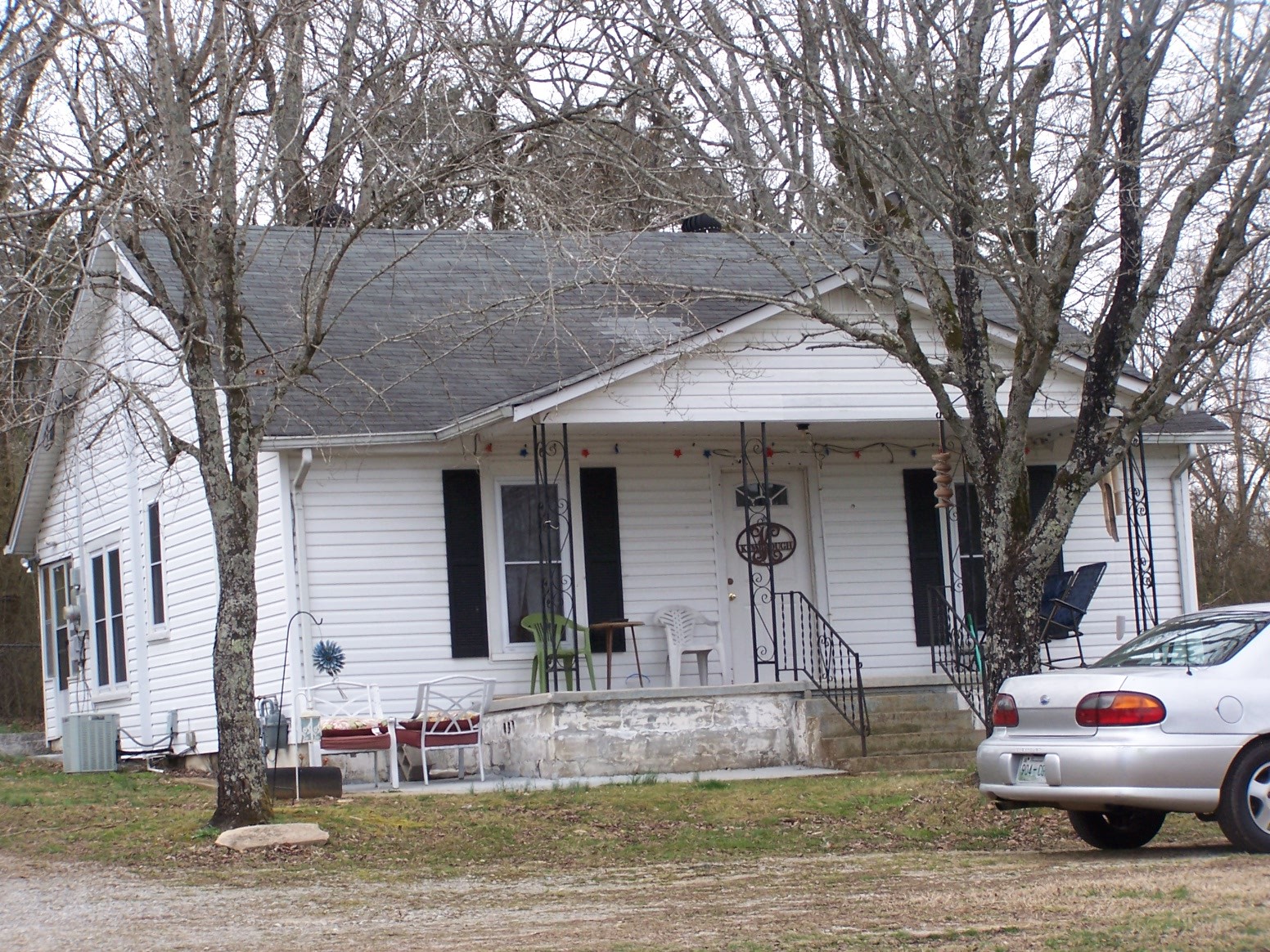 914 Bethel Road Pulaski, TN 38478 - Photo 3 of 15 a front view of a house with boat and trees
