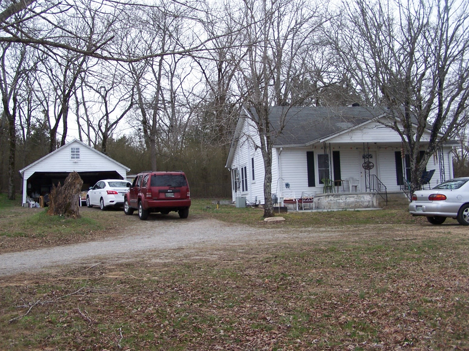 914 Bethel Road Pulaski, TN 38478 - Photo 4 of 15 a front view of a house with a garden and trees
