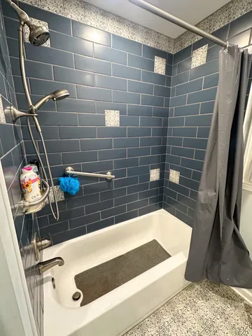 a bathroom with a sink and a shower