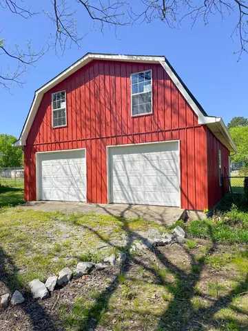 a view of back yard with an outdoor space