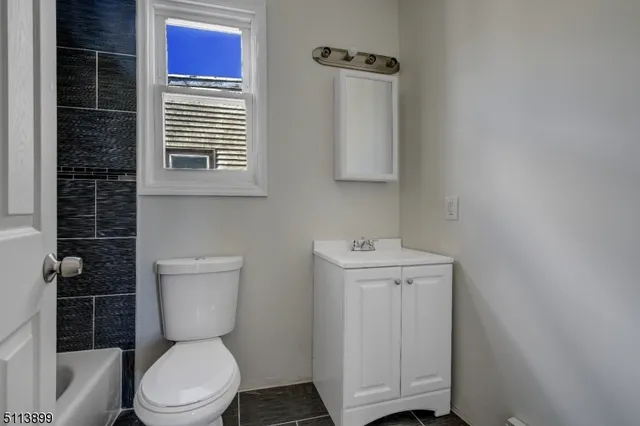 a bathroom with a toilet and a sink
