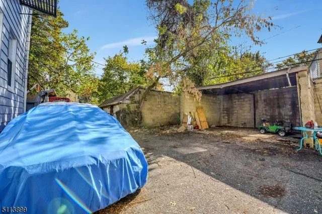 a view of a backyard with a tree