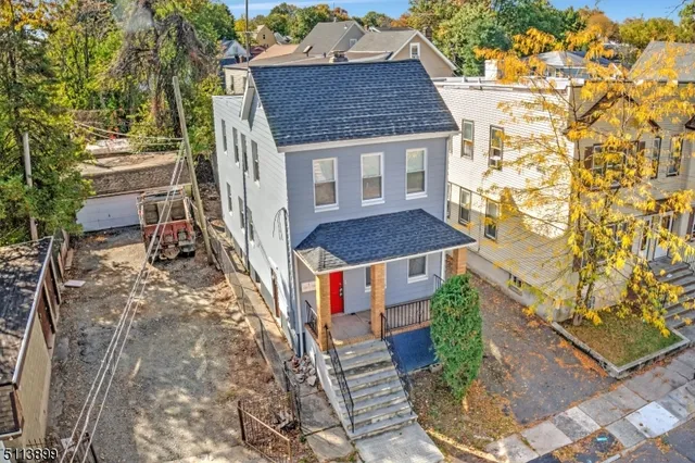 a aerial view of a house with a yard