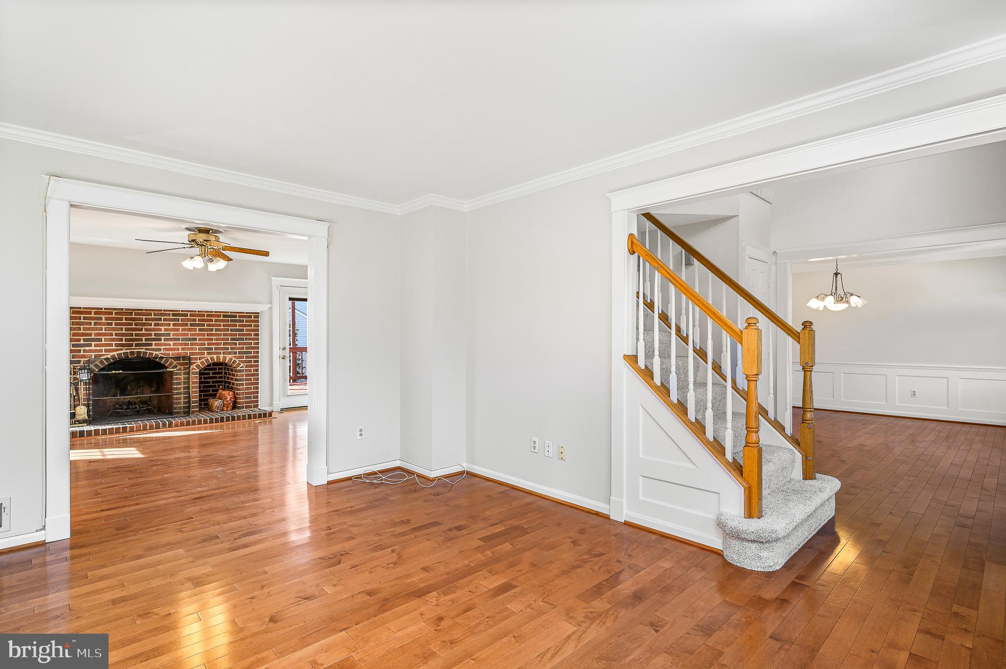 43356 Wayside Circle Ashburn, VA 20147 - Photo 14 of 52 a view of a livingroom with wooden floor and a fireplace