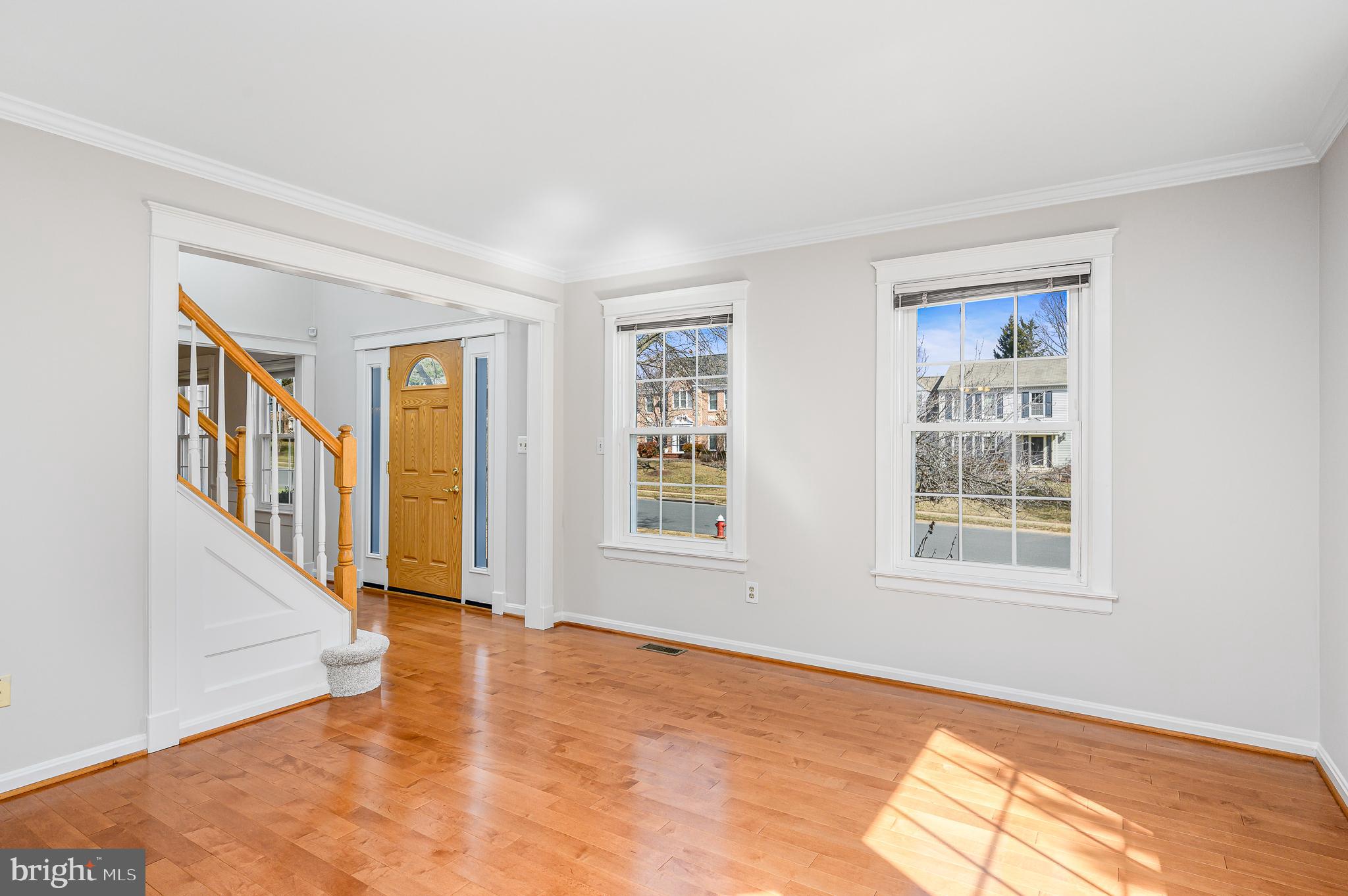 43356 Wayside Circle Ashburn, VA 20147 - Photo 15 of 52 a view of an empty room with wooden floor and a window