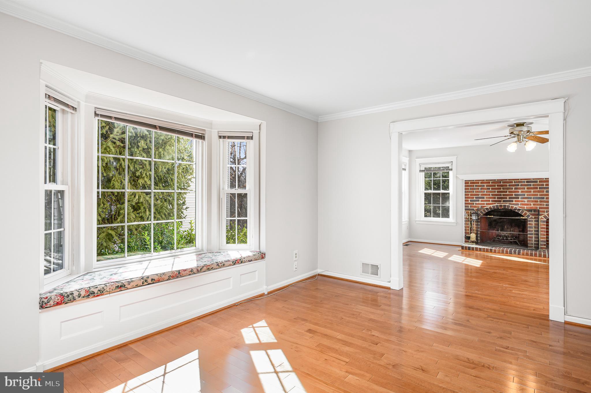 43356 Wayside Circle Ashburn, VA 20147 - Photo 16 of 52 a view of an empty room with wooden floor and a window