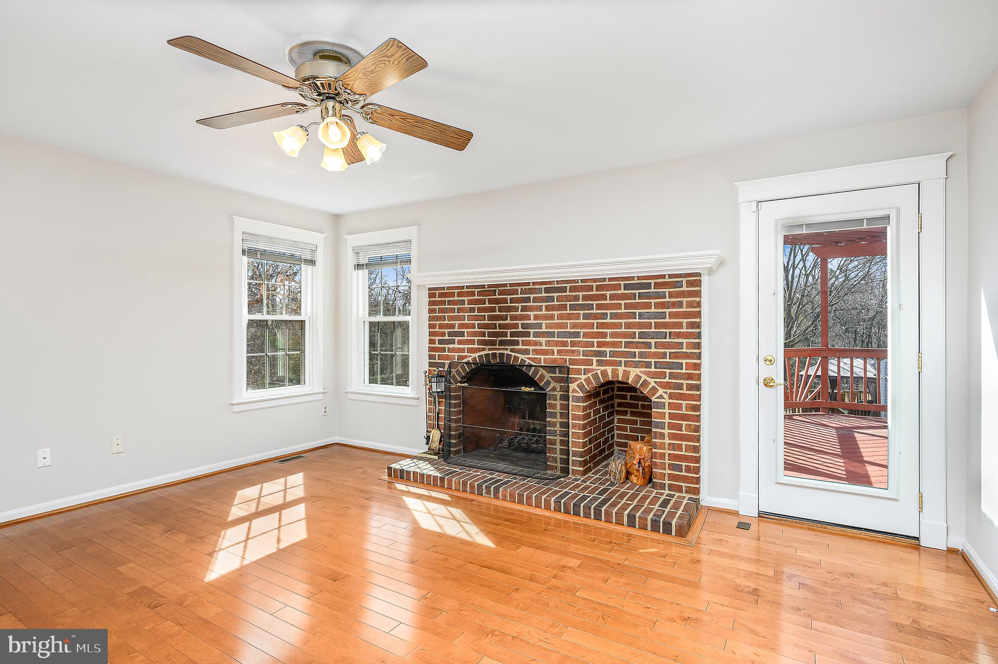 43356 Wayside Circle Ashburn, VA 20147 - Photo 19 of 52 a view of an empty room with a fireplace and a window