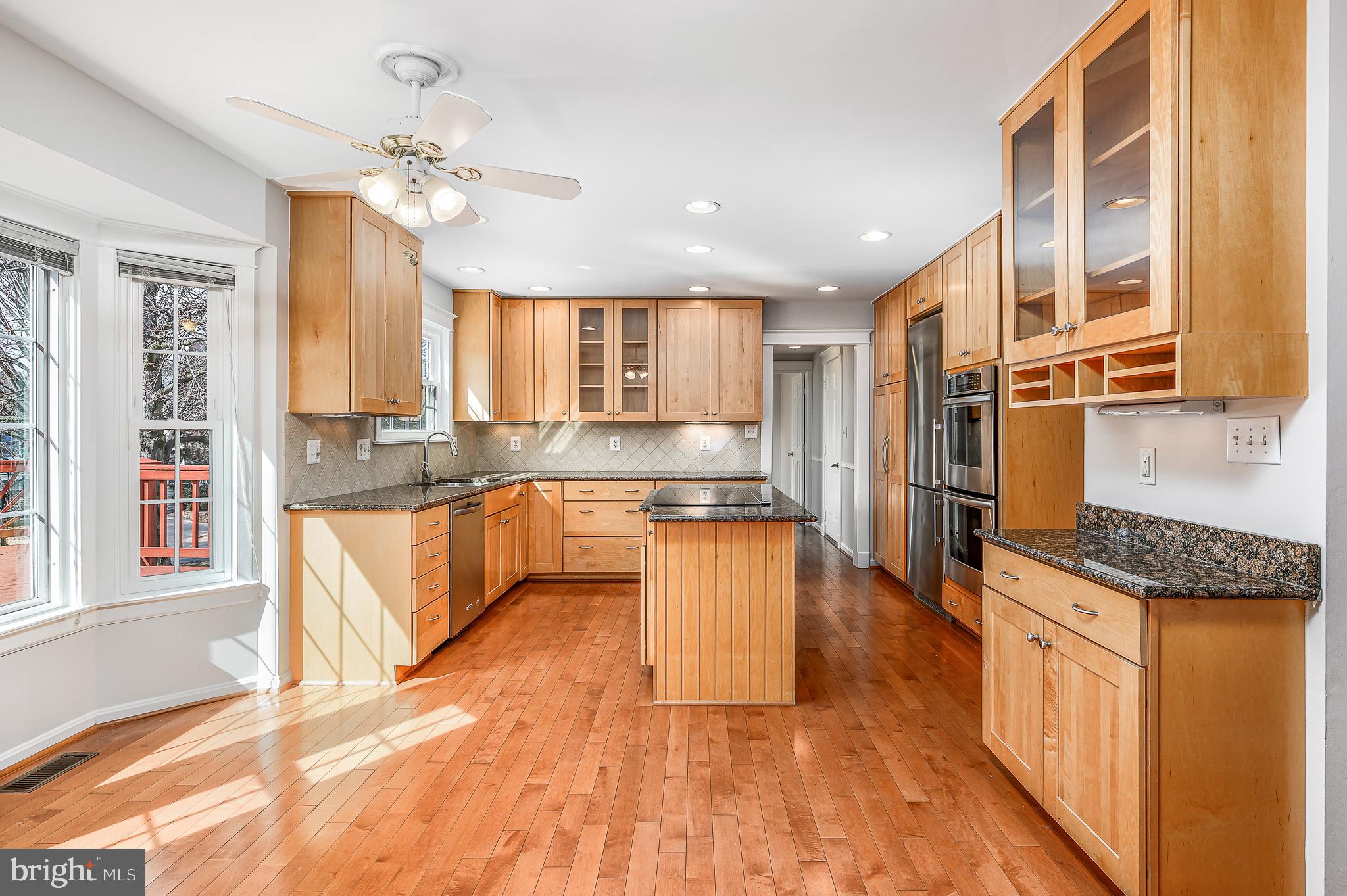 43356 Wayside Circle Ashburn, VA 20147 - Photo 20 of 52 a large kitchen with stainless steel appliances granite countertop a granite counter tops and a window