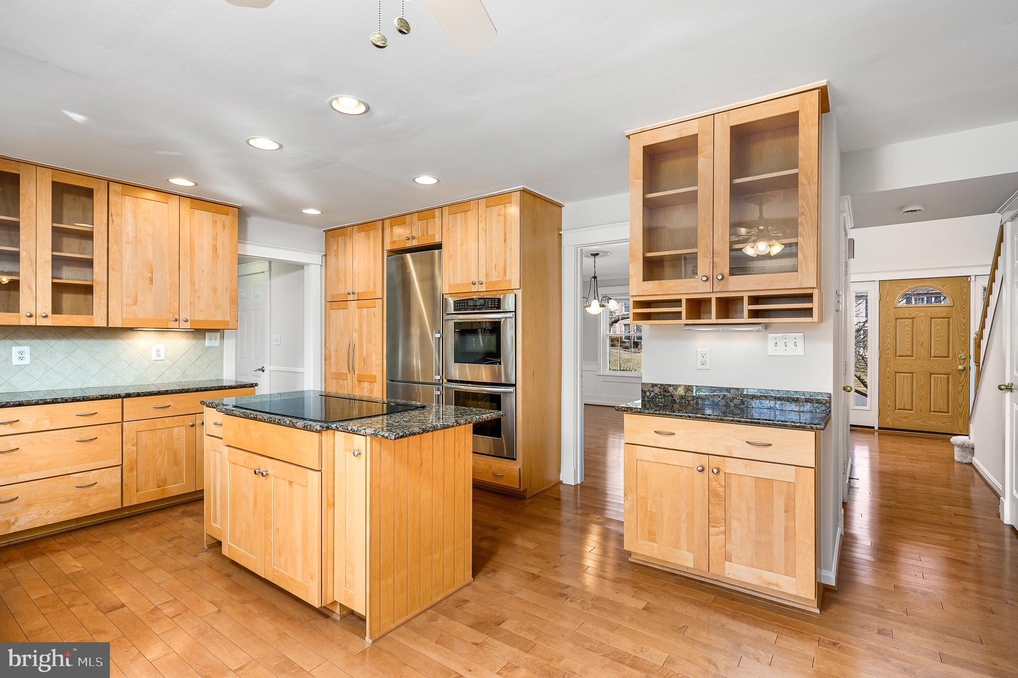 43356 Wayside Circle Ashburn, VA 20147 - Photo 21 of 52 a kitchen with stainless steel appliances granite countertop a stove and refrigerator