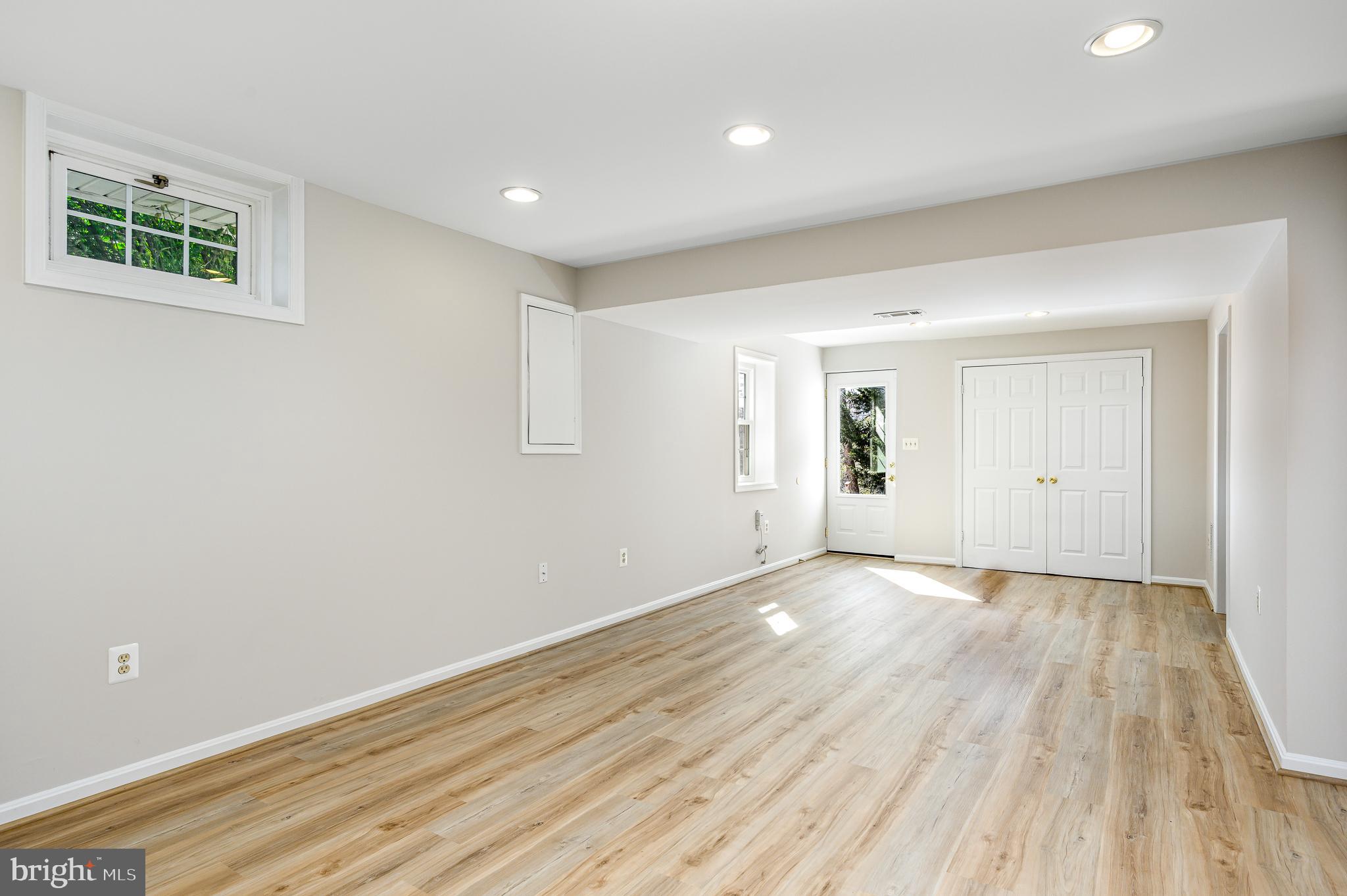 43356 Wayside Circle Ashburn, VA 20147 - Photo 44 of 52 a view of an empty room with wooden floor and a window