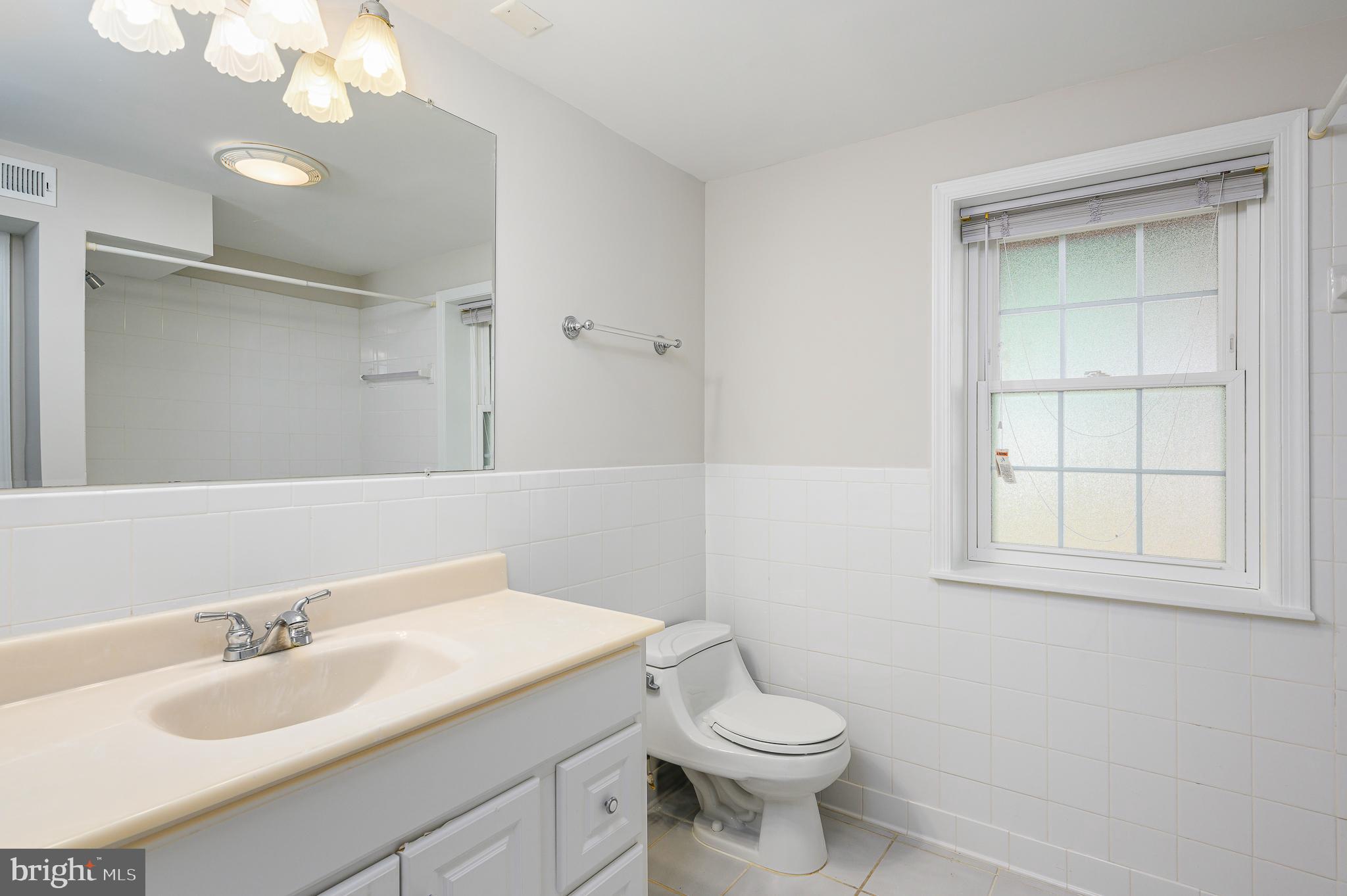 43356 Wayside Circle Ashburn, VA 20147 - Photo 50 of 52 a bathroom with a granite countertop sink mirror vanity and toilet