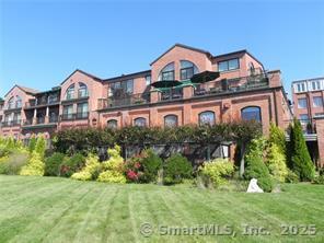 17 Water Street, Unit A10 Groton, CT 06355 - Photo 13 of 35 a front view of a house with a yard