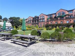17 Water Street, Unit A10 Groton, CT 06355 - Photo 17 of 35 a view of a house with a yard and sitting area