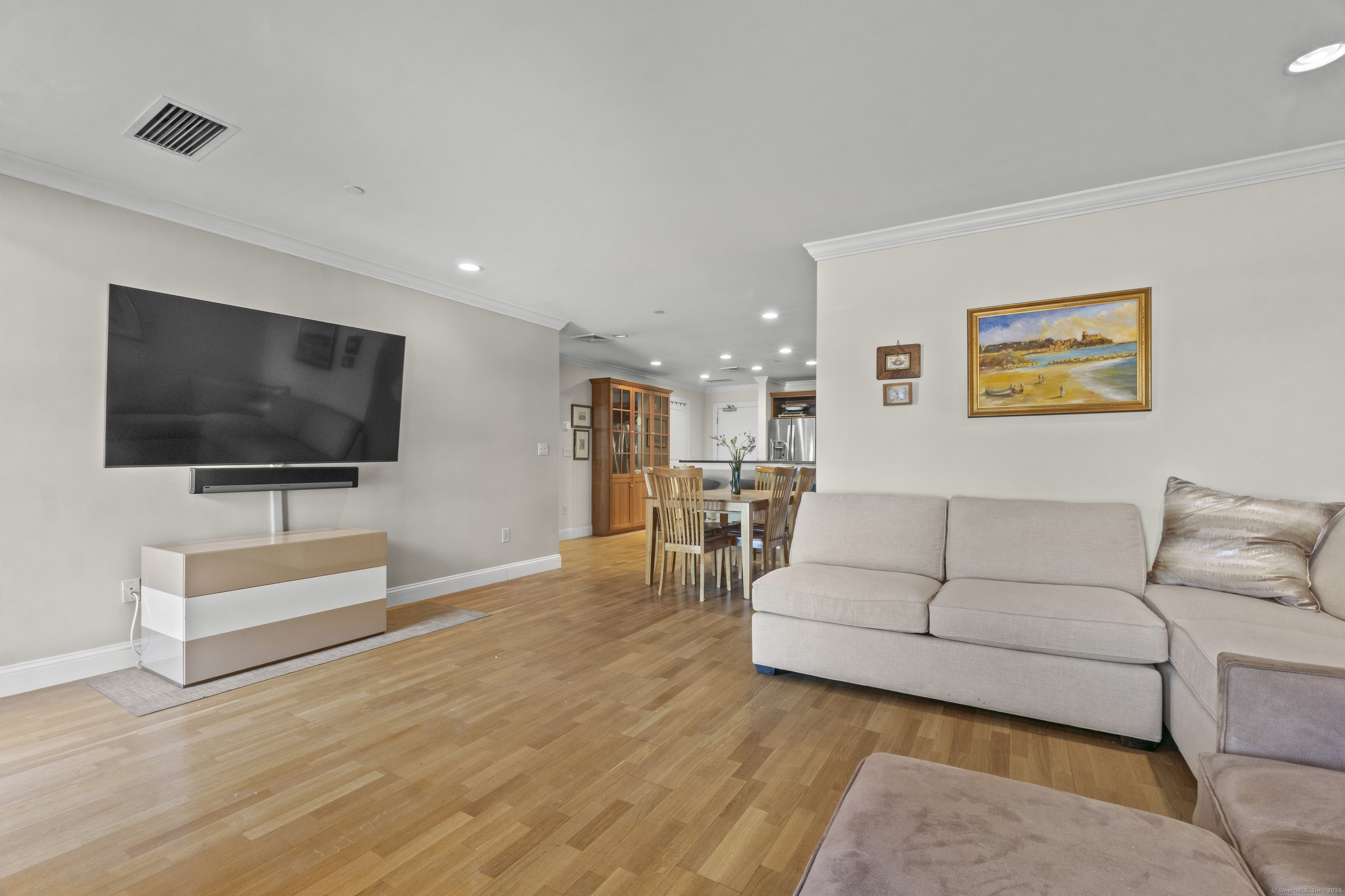 17 Water Street, Unit A10 Groton, CT 06355 - Photo 21 of 35 a living room with furniture and a flat screen tv